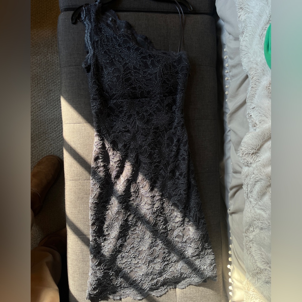Black embroidered one sleeve mini dress. Wore 1x to a wedding, great condition!